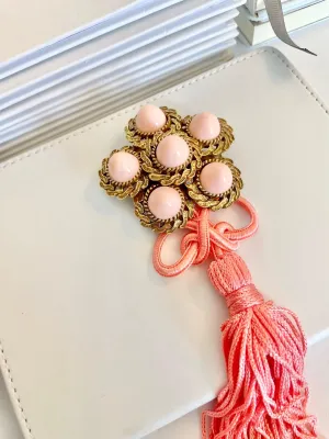 Vintage 1960’s faux angel skin coral brooch, with added tassel for a bit of fun flair!